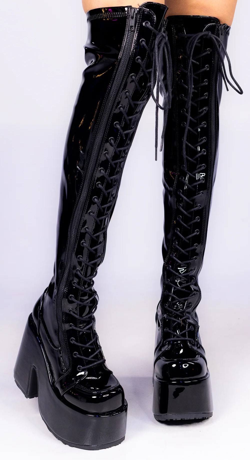 Black pvc thigh high, lace-up platform boots.