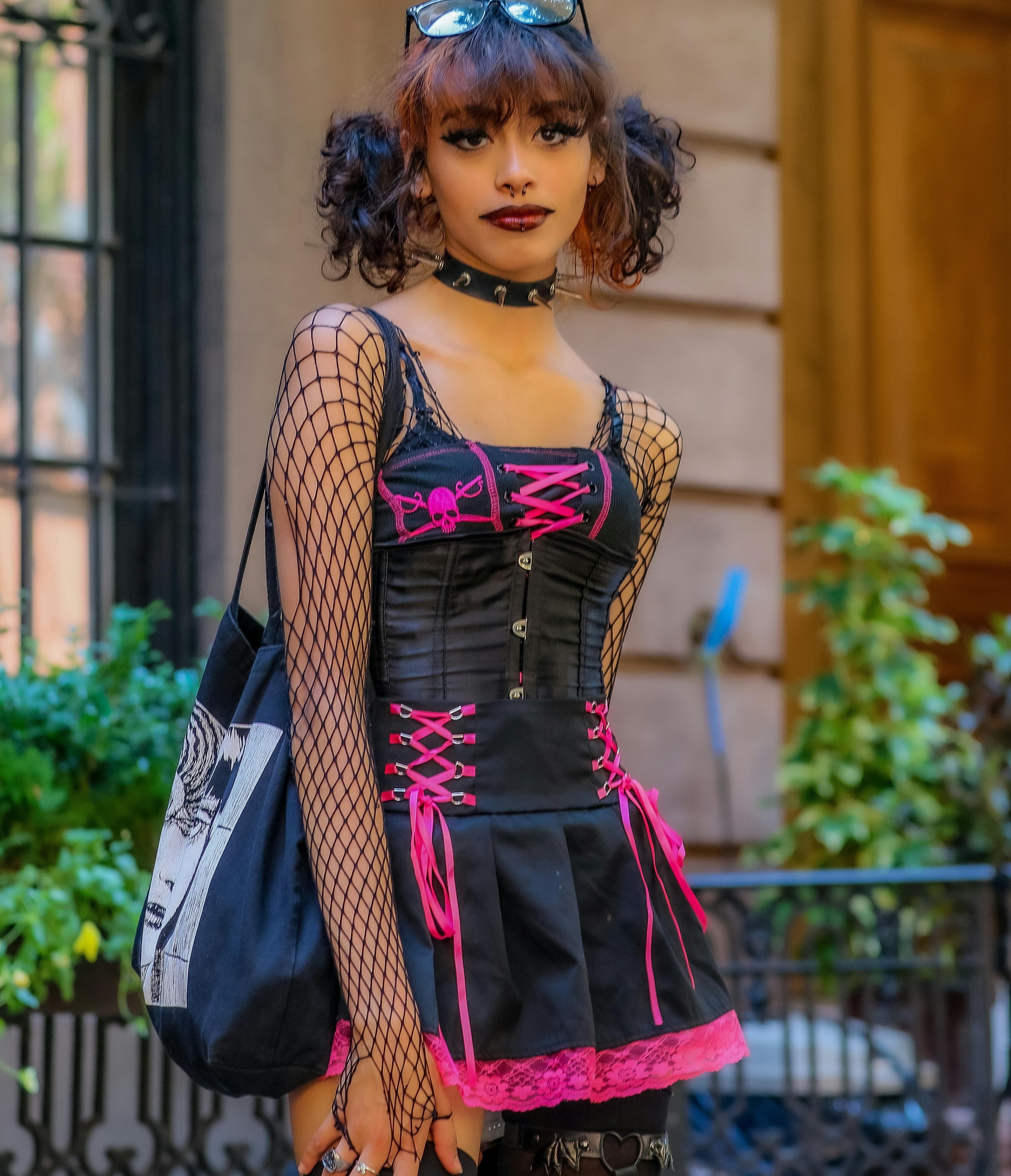 Concert outfit with dramatic layers, dark clothing, and boots