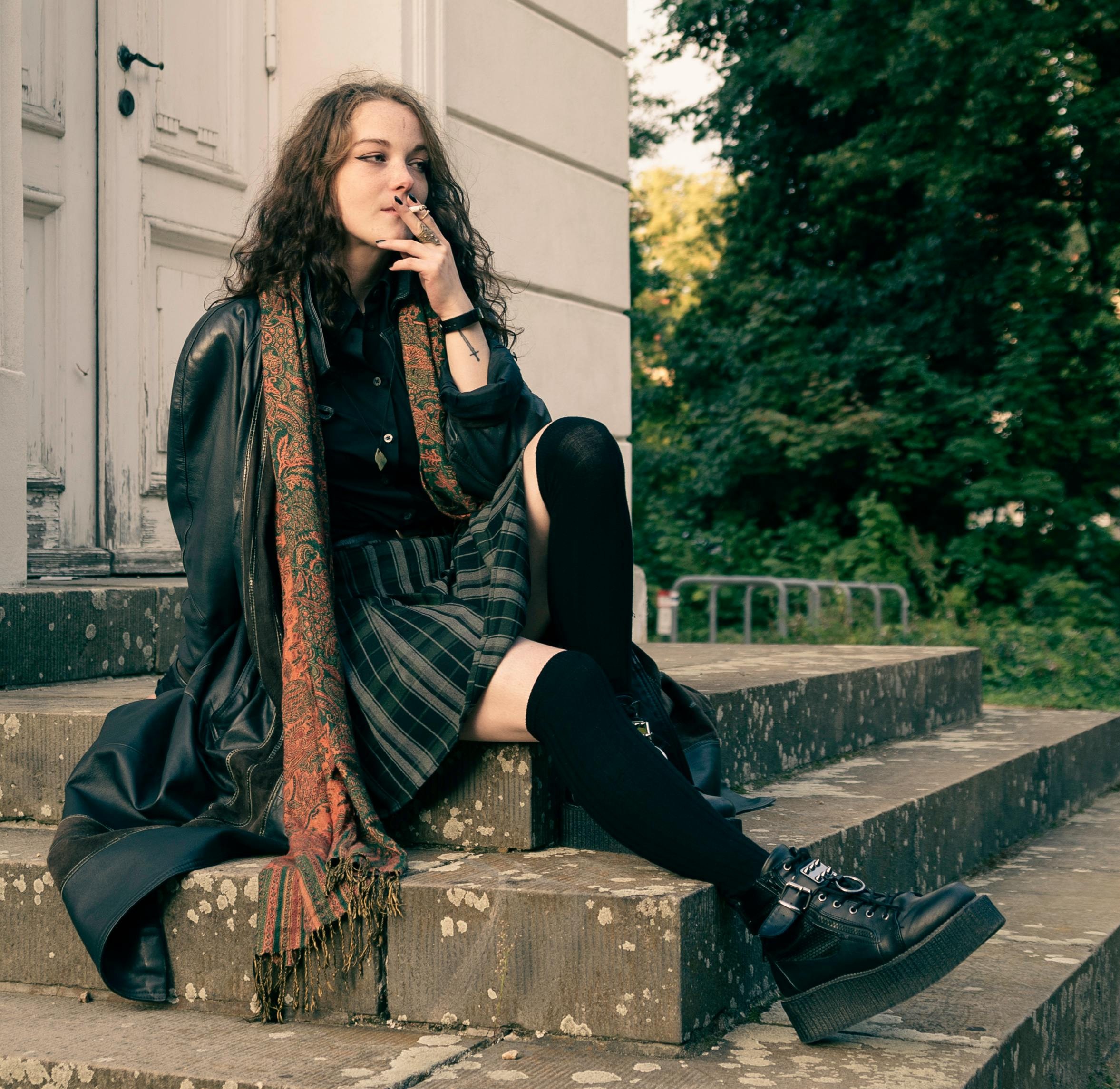 Cold weather alternative outfit with layered dark clothing and boots
