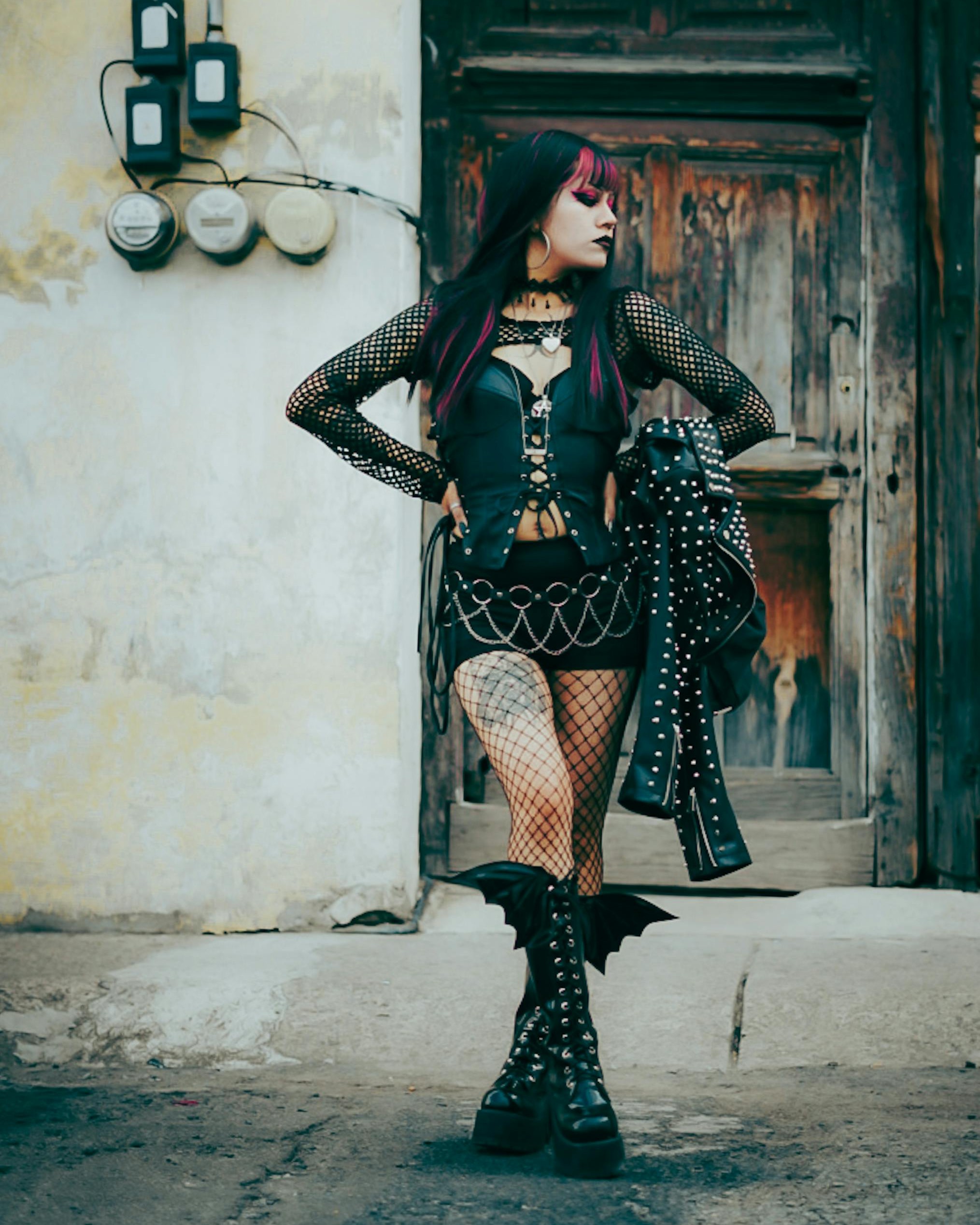 Concert-ready outfit with layered accessories and boots